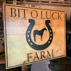 Sign with Horseshoe Imagery