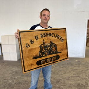 Business Sign with Tractor Imagery