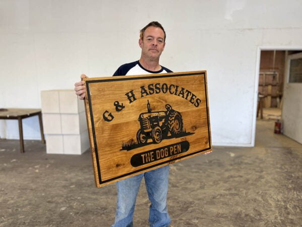 Business Sign with Tractor Imagery